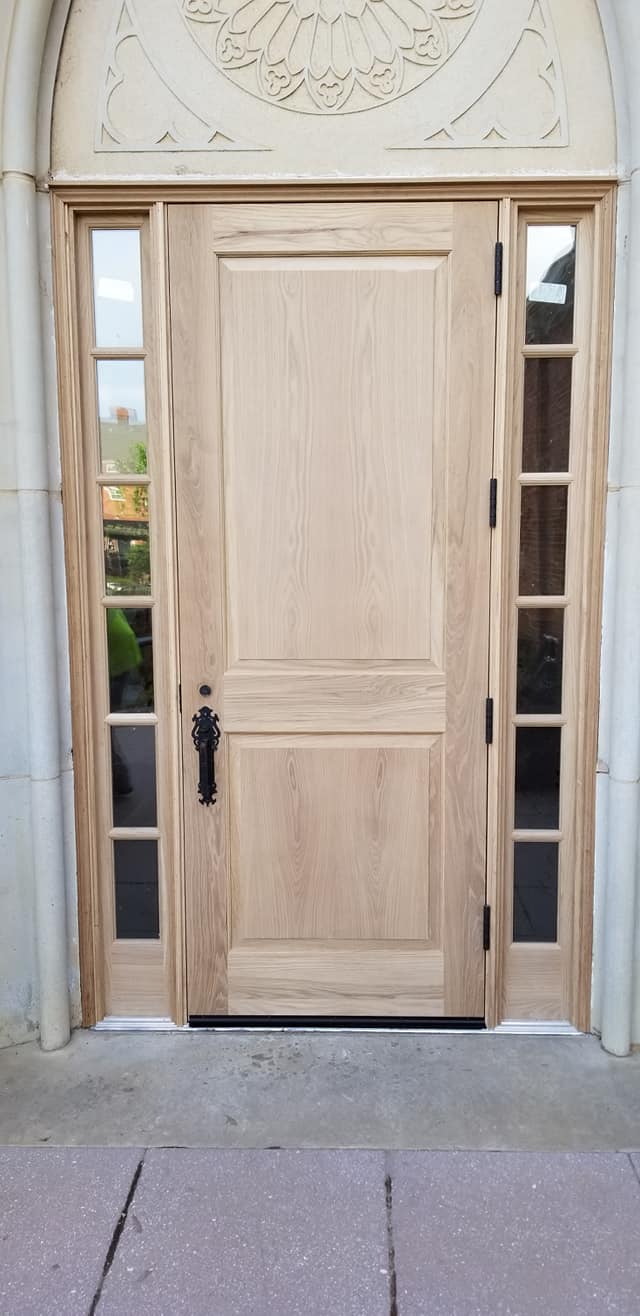 A door with two panels and one side glass.